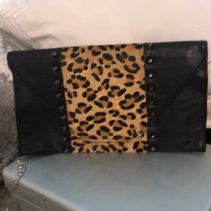 Black and leopard skin clutch with studs
